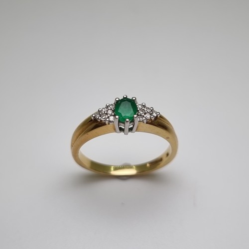 2 - Star Lot : An attractive 9 carat gold emerald stone ring, with diamond shoulders. Weight 4.15g, ring... 