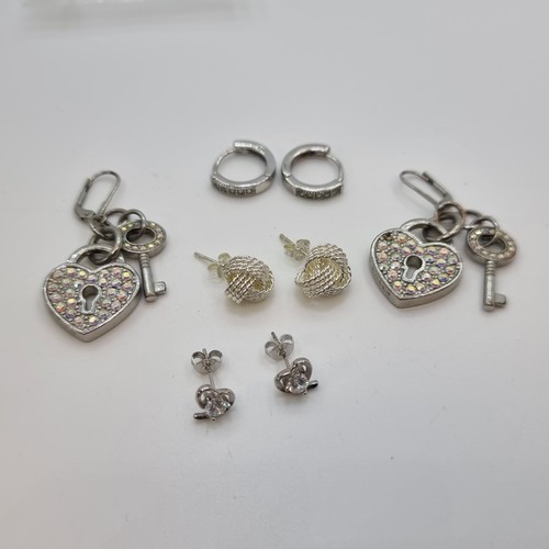 31 - Three sets of gemset earrings, all suitable for pierced ears. Includes a nice example of a heart loc... 