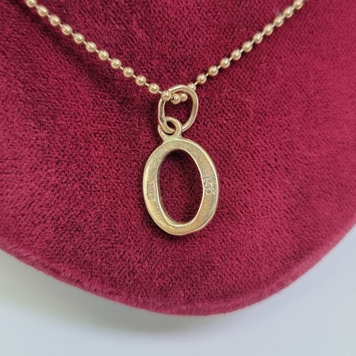 34 - A 9 carat gold, ball designed necklace chain, with oval drop pendant. Length of necklace 40cm, total... 