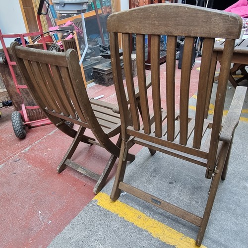 278 - Star Lot : A Bridgman Iroko outdoor dining set consisting of a table and 6 folding chairs (including... 