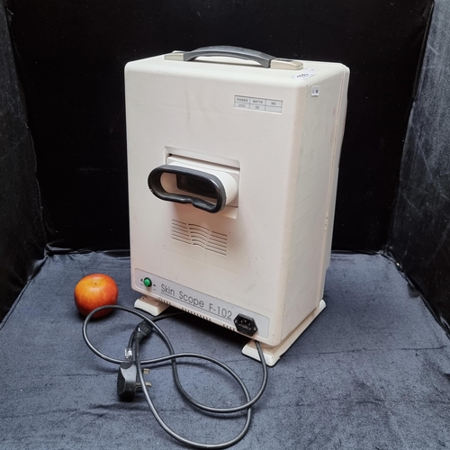 A portable F-102 Skin Scope Analyzer; diagnoses equipment for skin