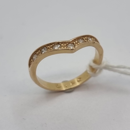 10 - An 18K rose gold wishbone style ring, featuring 7 diamond. Super pretty Ring size M, weight 2.8g.