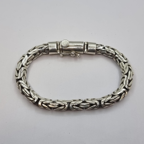 12 - An attractive sterling silver (stamped 925) heavy rope style bracelet. Length of piece 20cm, weight ... 