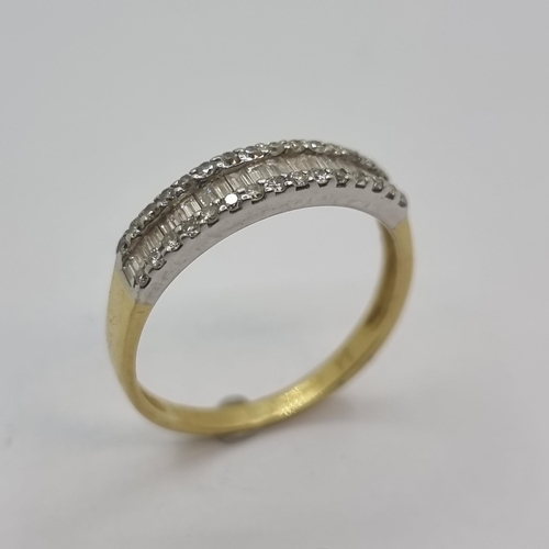 4 - Star Lot: A very pretty 18K gold (stamped 750) channel set diamond ring. Total weight of diamonds 0.... 