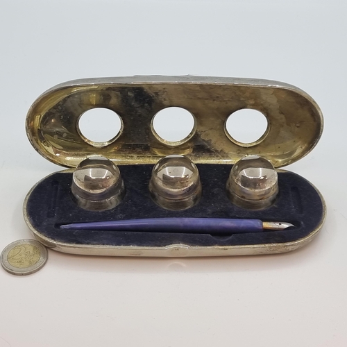 53 - An antique, Art Deco desk inkwell holder, containing three glass screw top inkwells, together with p... 