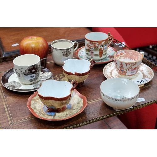 563 - Eleven pieces of mixed bone china teacups and saucers in a variety of patterns. SD