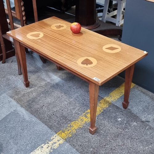 574 - A mid century coffee table with the four suites of playing cards symbols in wooden inlay. Great to u... 