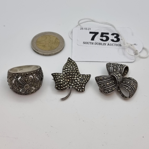 753 - Three pieces of vintage Art Deco sterling silver jewellery with marcasite including two brooches and... 