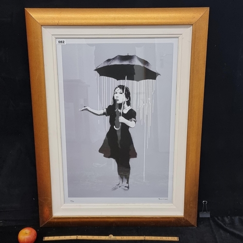 82 - Large very high quality print of Banksy's Nola (Girl with Umbrella), 2008, in a decorative frame. Mm... 