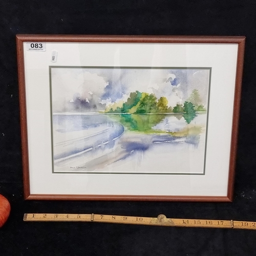 83 - Lovely, good size watercolour showing a lake with lush green island, signed bottom right by artist M... 