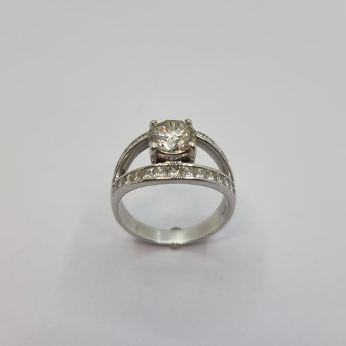 3 - Star Lot: A very fine 18K white gold solitaire ring. With central diamond of 1.6 carats, with diamon... 