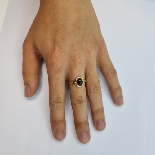 7 - A new 9K gold (stamped 375) cabochon stone garnet ring. Ring size P, weight 2.9g. Retail €275