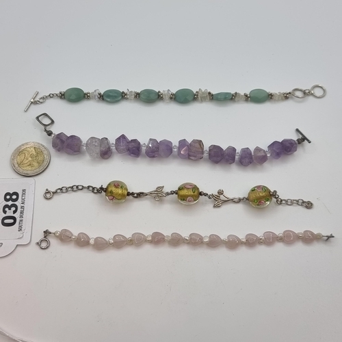 38 - Four sterling silver bracelets. The first with amethyst stone and quartz set accents, together with ... 