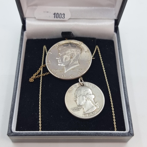 466 - A 1964 90% proof silver Kennedy half-dollar brooch with safety chain. Together with a quarter dollar... 