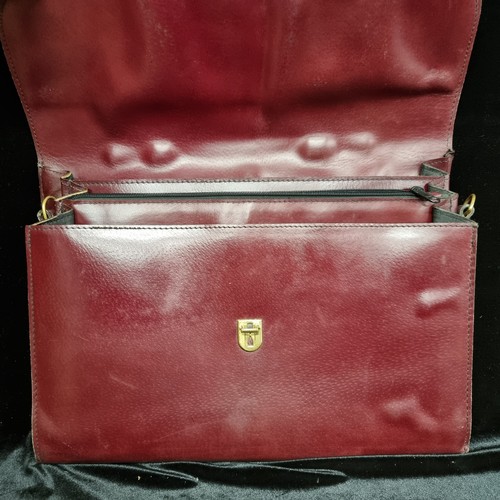 104 - Two vintage genuine leather satchel briefcases. One in a warm chestnut colour with brass fixtures an... 