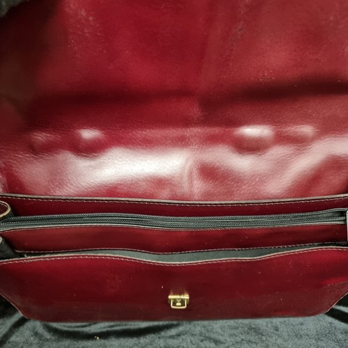 104 - Two vintage genuine leather satchel briefcases. One in a warm chestnut colour with brass fixtures an... 