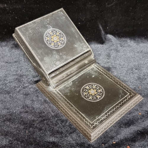 118 - An elegant vintage Damascene cigarette dispenser with beautiful gold and silver inlay. A heavy and a... 