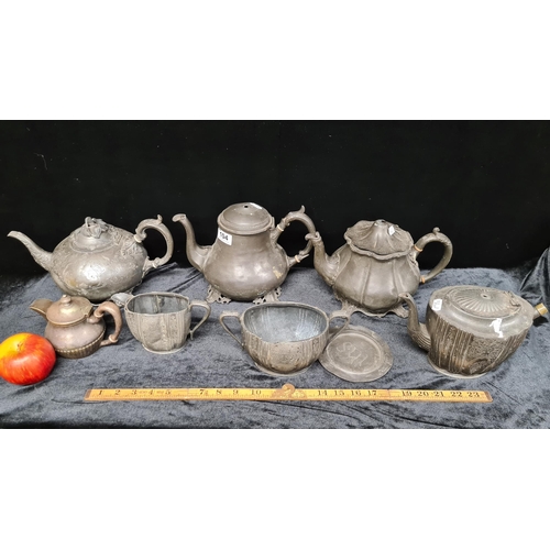 104 - Eight pieces of antique pewter metal ware, including a Dodds & Co. 6 1/2 pint teapot and a Hotel Bel... 