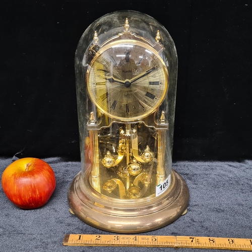 105 - A vintage Kundo Anniversary clock, glass dome.