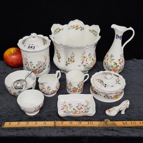 243 - Ten pieces of Aynsley china in the 'Cottage Garden' pattern, including biscuit jar, jugs and dishes ... 