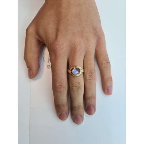 5 - A super 9K gold ring (stamped 375) with a large colourful moonstone setting. Ring size P 1/2, weight... 