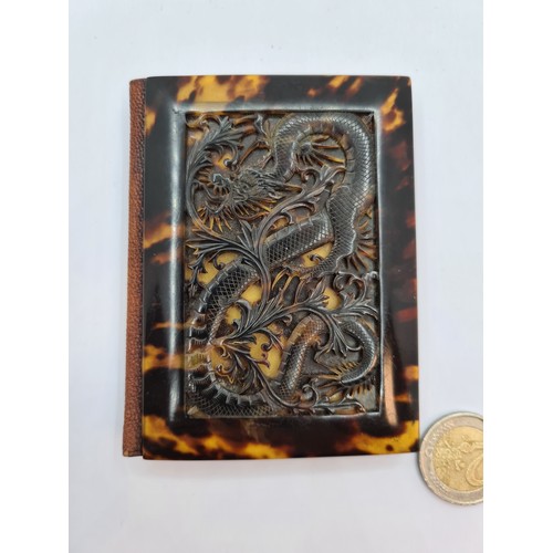 765 - Super 1920s Tortoise shell card case with silk lining and a very well carved dragon decoration. Tort... 