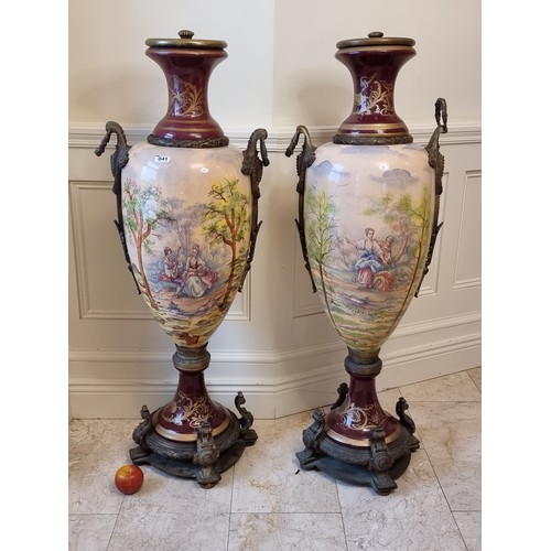 41 - Star Lot : A pair of monumental, hand-painted ceramic urns in a Sevres Style. Featuring Rococo scene... 