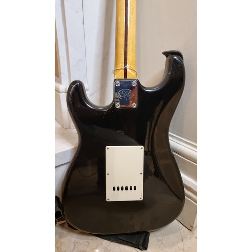 A SX Custom Handmade Traditional Series electric guitar in a