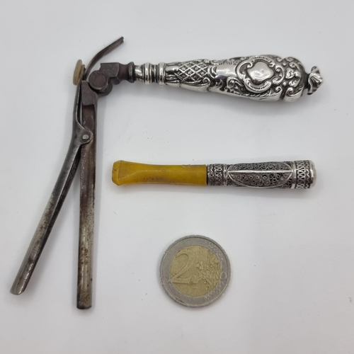 44 - Two sterling silver topped items consisting of an Edwardian Mustache curler with large Silver handle... 