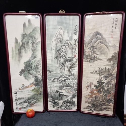 69 - Three large framed original watercolour and ink panels, depicting a traditional Chinese mountainous ... 