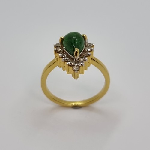 369 - Stat Lot : A gorgeous 14k gold ring set with a Pear Cabochon Tsavorite Garnet. Surrounded by 16 natu... 