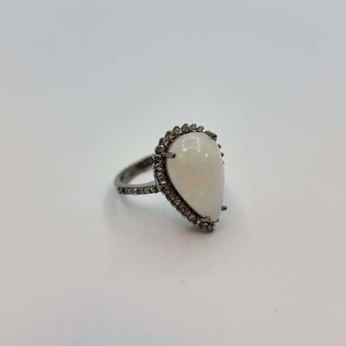 364 - Fabulous Sterling Silver ring With a huge Fire pear shaped opal 4.2cts surrounded by Diamonds. Also ... 