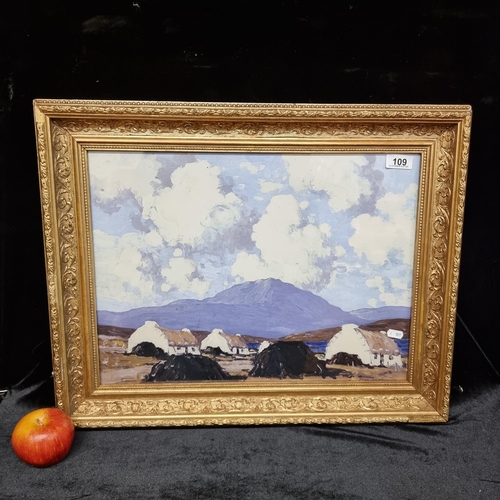 109 - A good sized high quality print of a painting by Paul Henry showing his quintessential white cottage... 