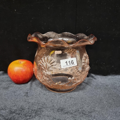 116 - A victorian rose pink glass oil lamp shade with fluted rim and floral and garland decoration in reli... 