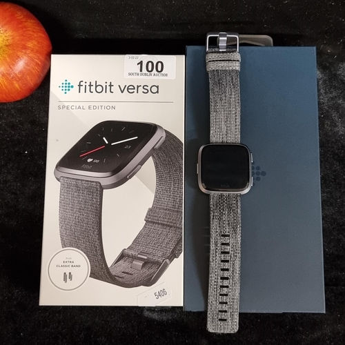 100 - A Fitbit Versa Special edition with aluminum case, charcoal woven band and with extra black classic ... 