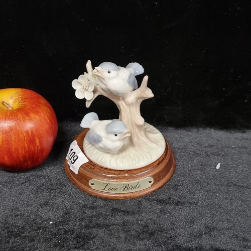 109 - A vintage lladro porcelain figure of Love Birds perched on tree in lovley pastel tones, mounted on a... 