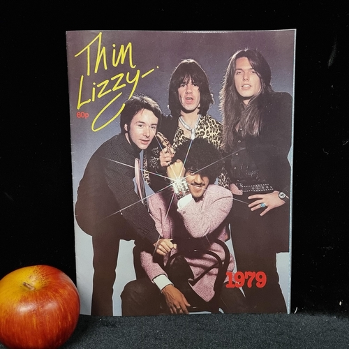 93 - A copy of Thin Lizzy The Approved Biography from 1979 with interviews from the band members, photos ... 