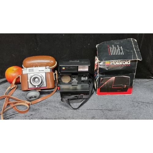 94 - Two vintage cameras including a rare 1980's Polaroid Autofocus 660 in original packaging with instru... 