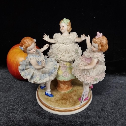 73 - Star Lot : A super vintage Irish Dresden handcrafted porcelain figurine depicting three young girls ... 