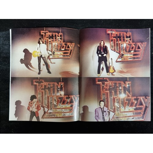93 - A copy of Thin Lizzy The Approved Biography from 1979 with interviews from the band members, photos ... 