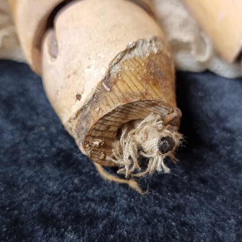 105 - A 19th century doll with a beautiful hand painted porcelain head with realistic features, blue glass... 