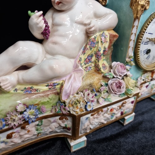 115 - Star Lot : An impressive antique Meissen porcelain figural mantel clock with a young reclining Bacch... 