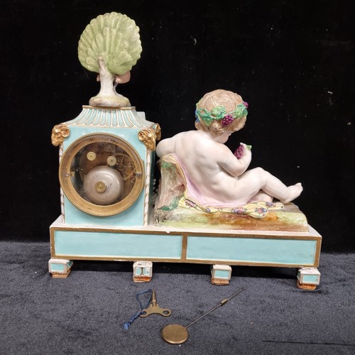 115 - Star Lot : An impressive antique Meissen porcelain figural mantel clock with a young reclining Bacch... 