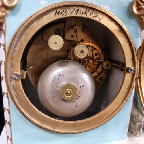 115 - Star Lot : An impressive antique Meissen porcelain figural mantel clock with a young reclining Bacch... 