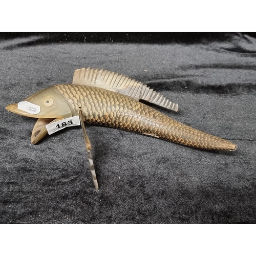 183 - A fish statue hand-crafted from genuine horn, with lovely detailed scales.