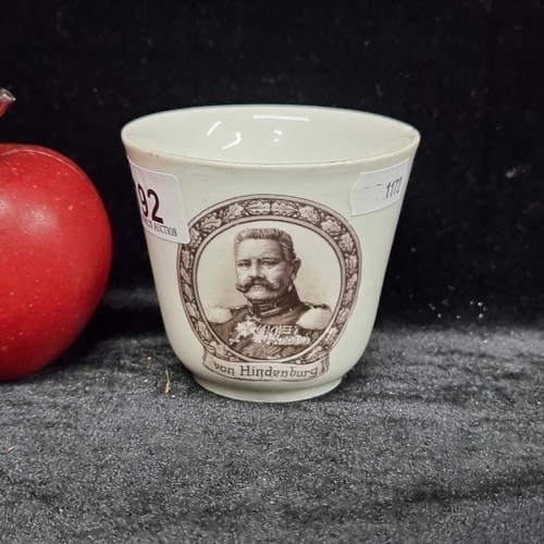 192 - An original porcelain tea cup illustrated with a vignette of Paul von Hindenburg; von Hindenburg led... 