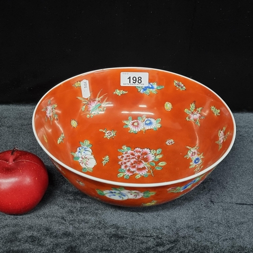 198 - A beautiful hand painted Chinese ceramic bowl -  in a shade of deep orange, with delicate sprigs of ... 