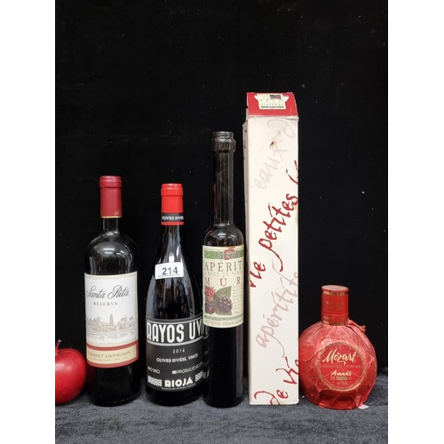 214 - Four bottles of alcoholic beverages including Mozart chocolate orange amade, 0.5l and Olivier Rivier... 