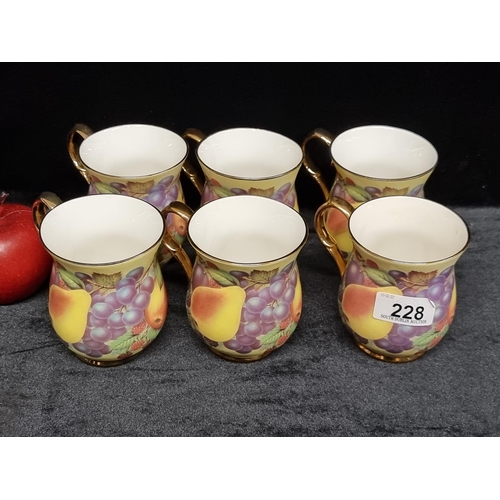 228 - Six pieces of Doug Hague bone china in the Orchard fruit pattern. All in very good condition.