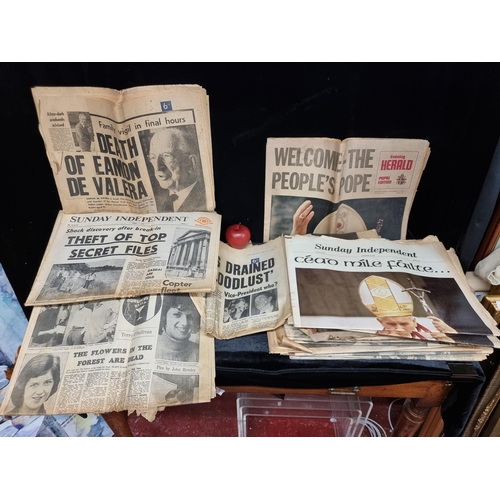 274 - A large collection of irish 1950's / 1970s newspapers covering important historical events such as N... 